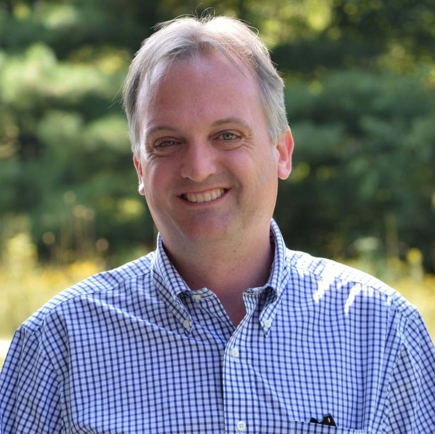 Wall Residences Admissions Director Alex Jackson standing outside