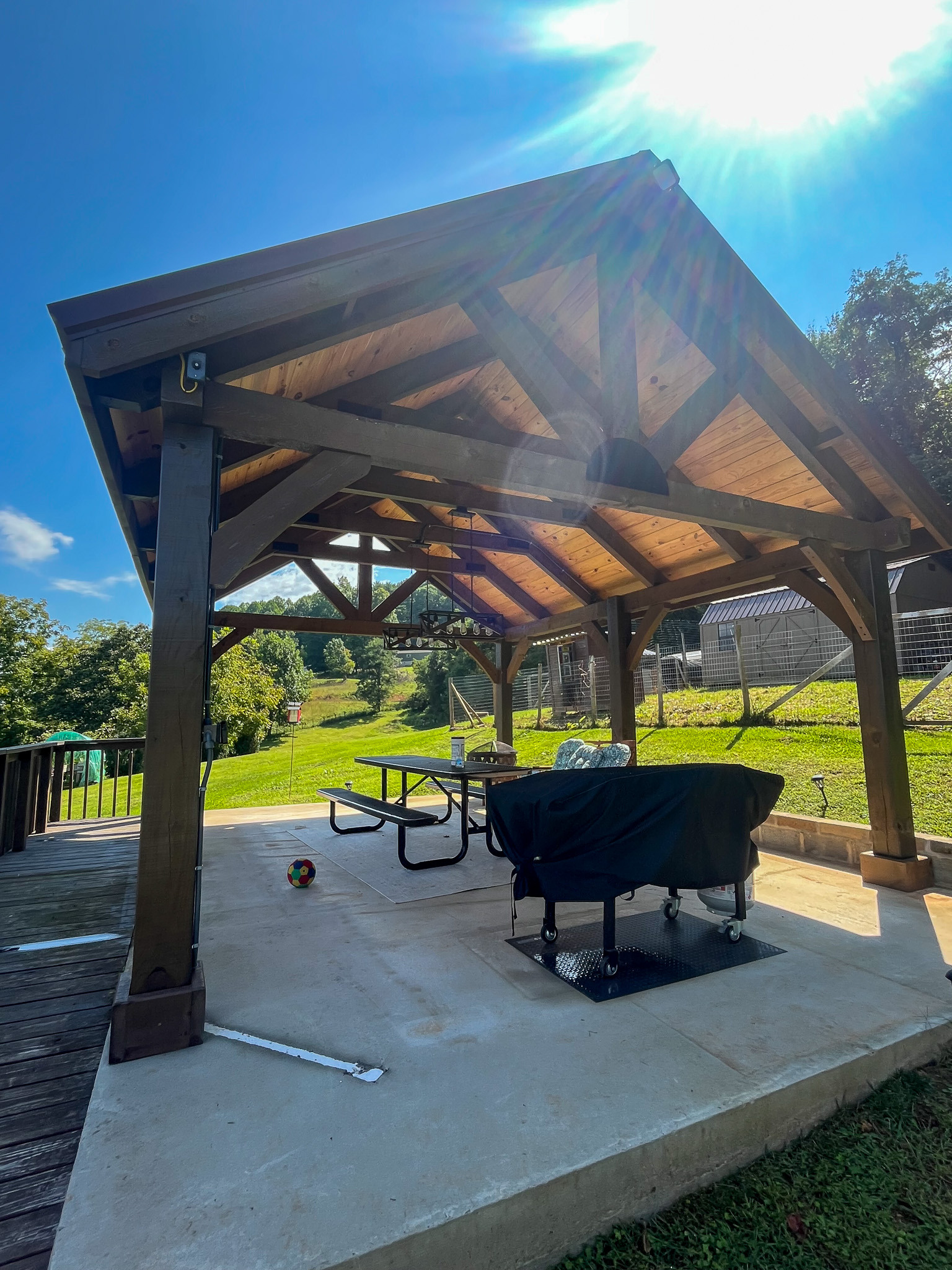 Covered outdoor pavilion with picnic seating and open views of the surrounding property and countryside. This is the home of Sponsored Residential Provider Delmy Sexton in Woodlawn, VA.