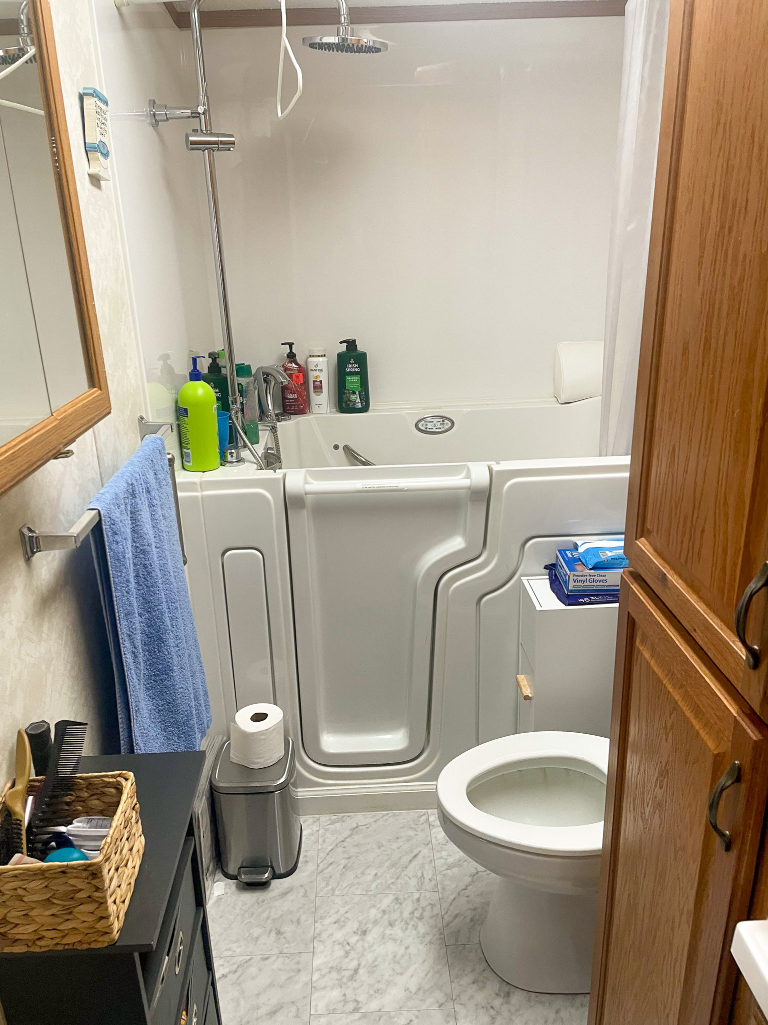 Accessible bathroom in the home of Sponsored Residential Providers Janice and Kenny Cox in Willis, Virginia, featuring a walk-in tub with grab bars and safety features to support mobility needs.