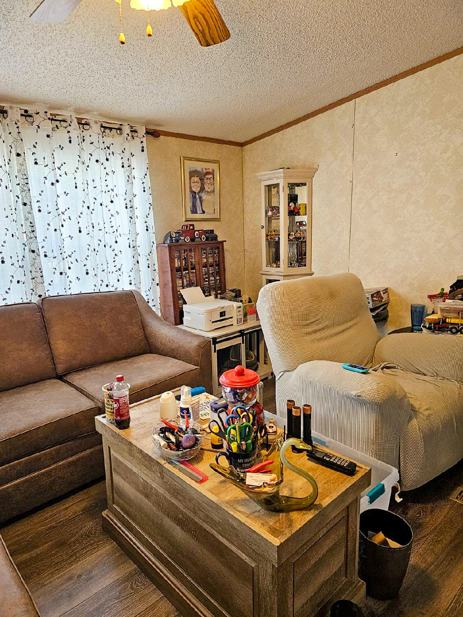 Living room in the home of Sponsored Residential Providers Janice and Kenny Cox in Willis, Virginia, featuring comfortable seating, a coffee table, and a welcoming space for relaxation and daily activities.
