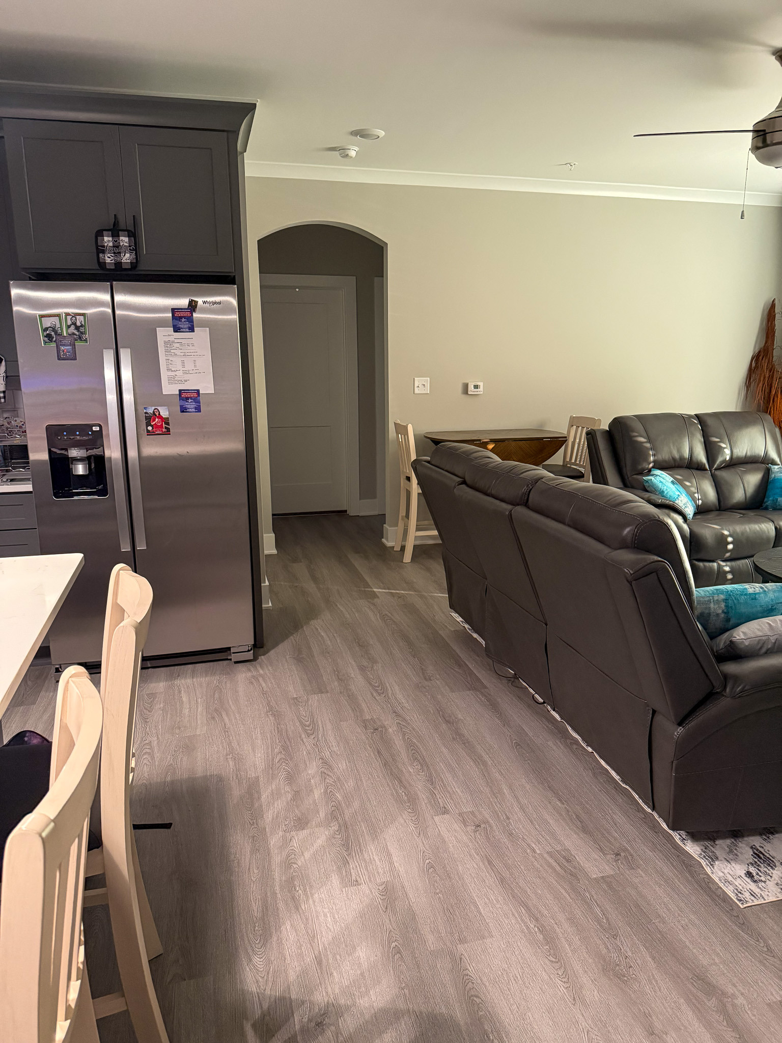 Open-concept living and dining area with comfortable seating and modern finishes in the home of Sponsored Residential Provider Justina Megginson in Roanoke, Virginia.
