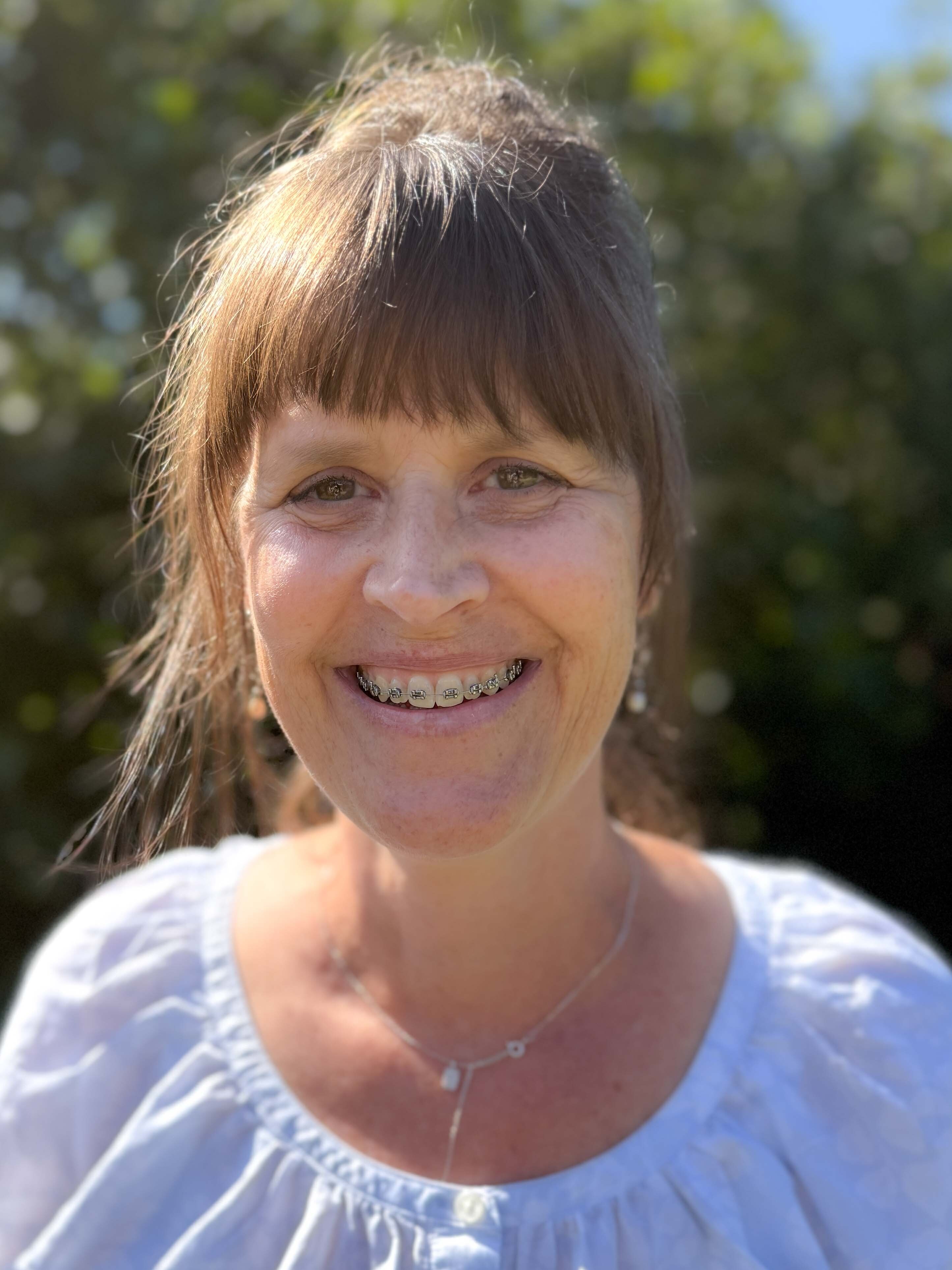 Wall Residences Compliance Director Kathryn Moats standing outside