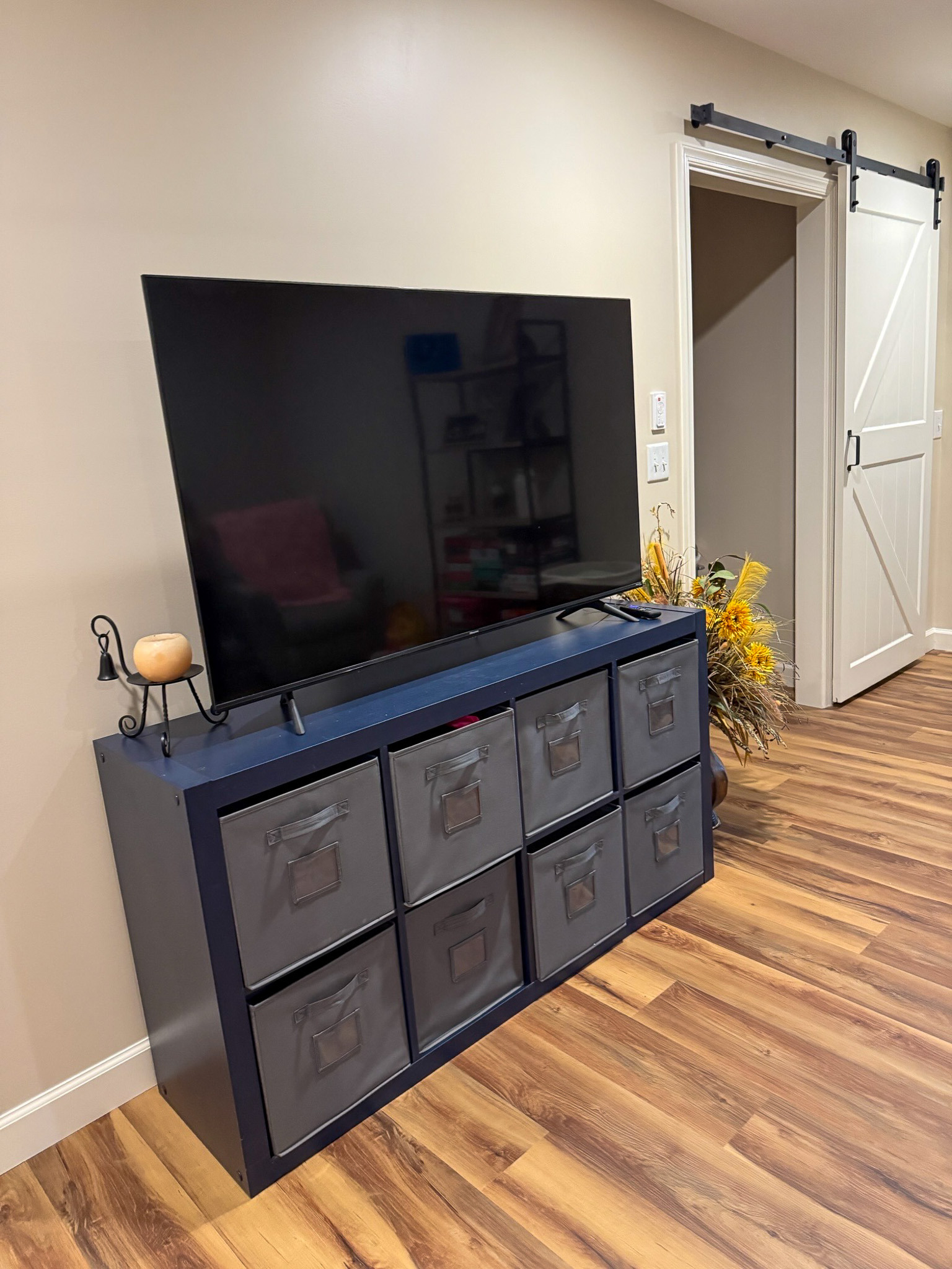 omfortable gathering space with seating, shelving, games, and wood flooring in the home of Wall Group Home provider Lisa Lohr in Harrisonburg, VA.