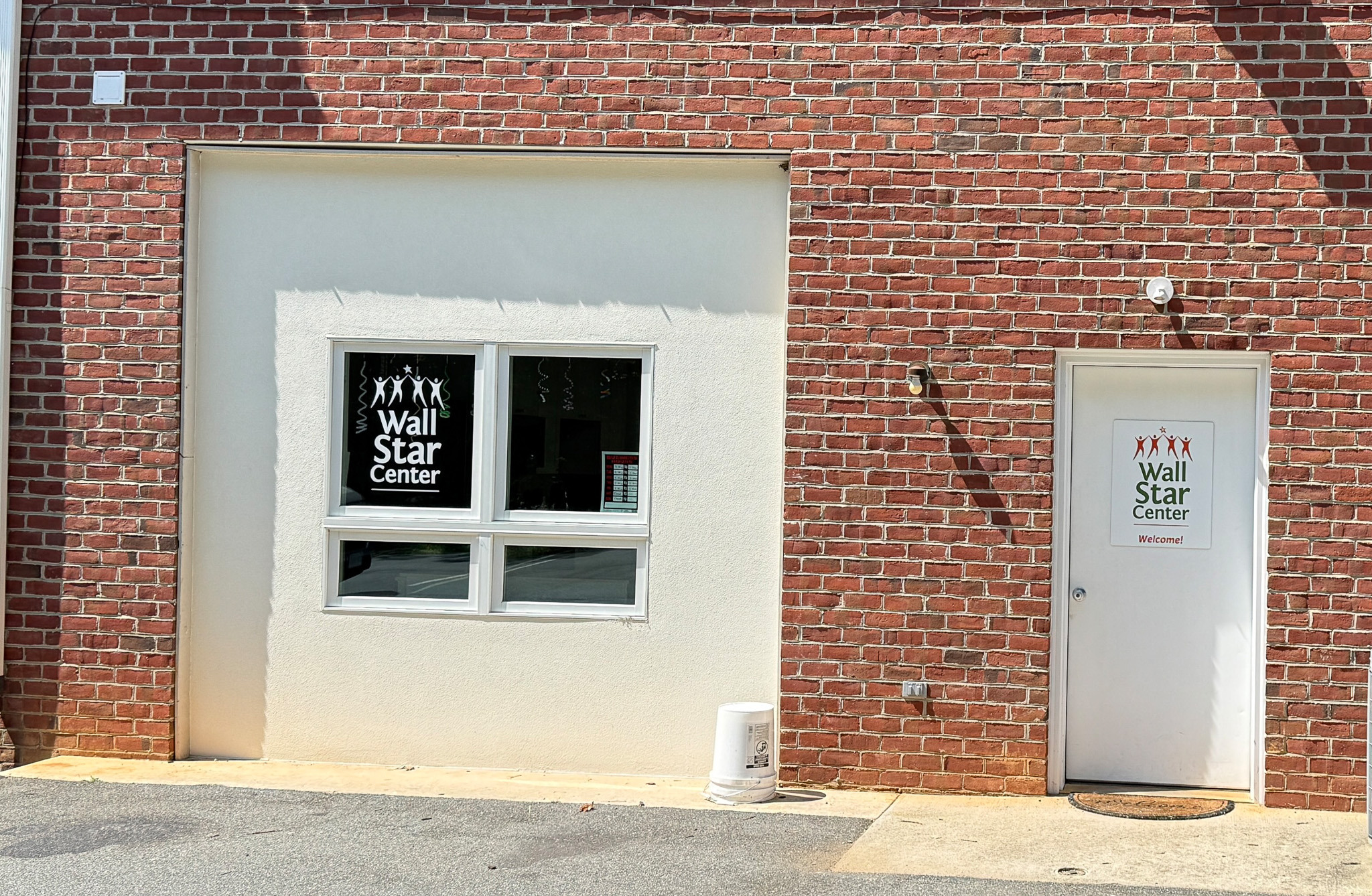 Door and window in brick building at entrance to Madison Heights Star Center.