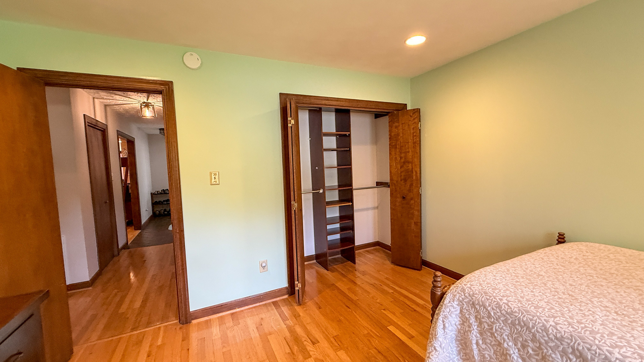 Private bedroom featuring hardwood floors, a closet, and natural light inside the home of Sponsored Residential Providers Anna Robertson and Christopher Pietrzyk in Roanoke, VA.