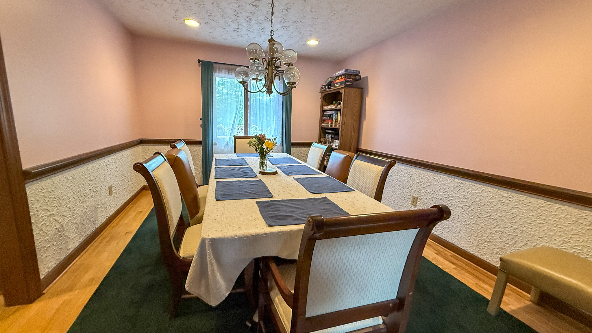 Formal dining room with seating for six and hardwood floors inside the home of Sponsored Residential Providers Anna Robertson and Christopher Pietrzyk in Roanoke, VA.