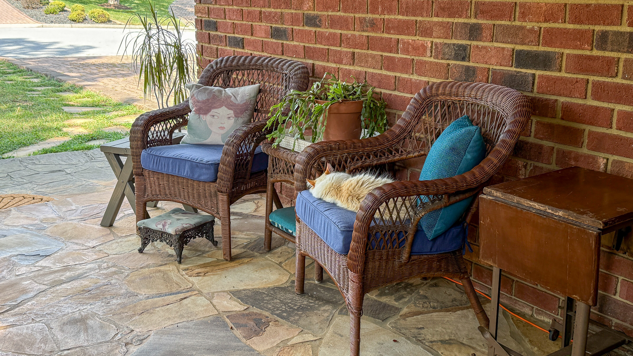 Covered front patio with comfortable seating and outdoor gathering space at the home of Sponsored Residential Providers Anna Robertson and Christopher Pietrzyk in Roanoke, VA.