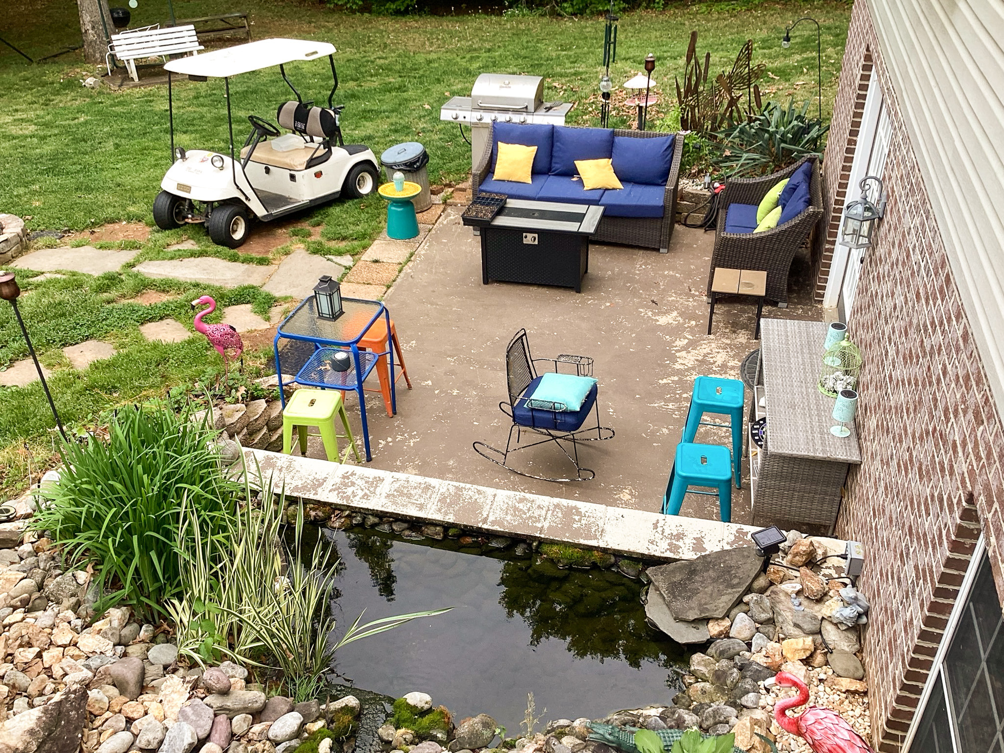 Welcoming backyard patio with seating, garden touches, and a small pond feature, at the home of Sponsored Residential Provider Roxane Barnes.