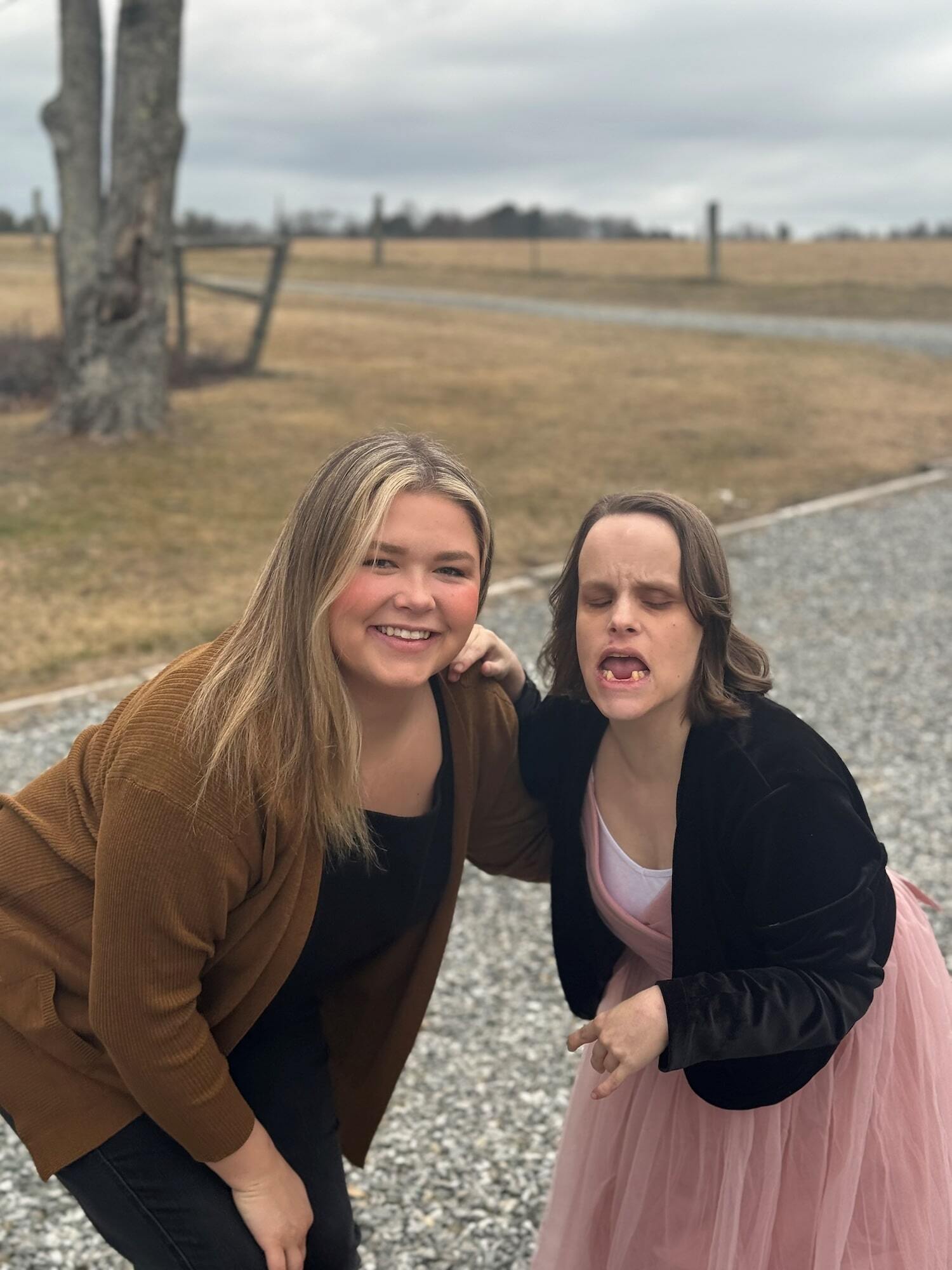 Two women dressed up smiling at the camera