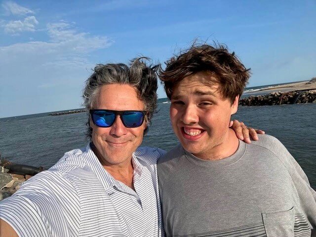 Parent provider and son at beach